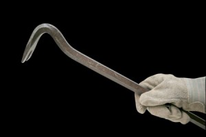 crowbar with glove isolated on black background clipping path embedded